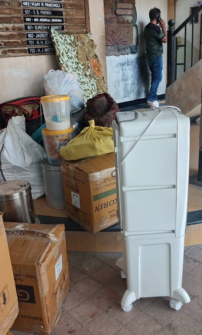 Speed Move team loading household goods and appliances from a Surat society building